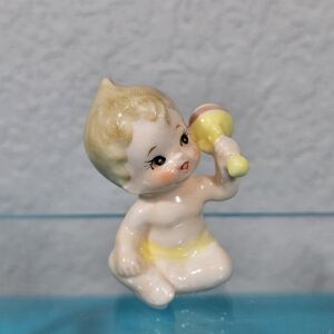 Vintage Ceramic Baby Figurine Holding a Rattle